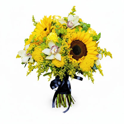 Flower Station Iberian Beauty bouquet featuring large yellow sunflowers, pink Phalaenopsis orchids, and yellow solidago.